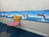 Dolphins Frieze 80011 (wide border) Gorgeous blue Dolphins Frieze (wide border). 46.5cm wide x 400 long. Paste the wall. *Chair used to illustrate scale*