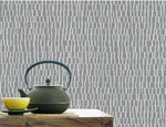 b510011b Modern textured design in grey set on a silver glitter background.
